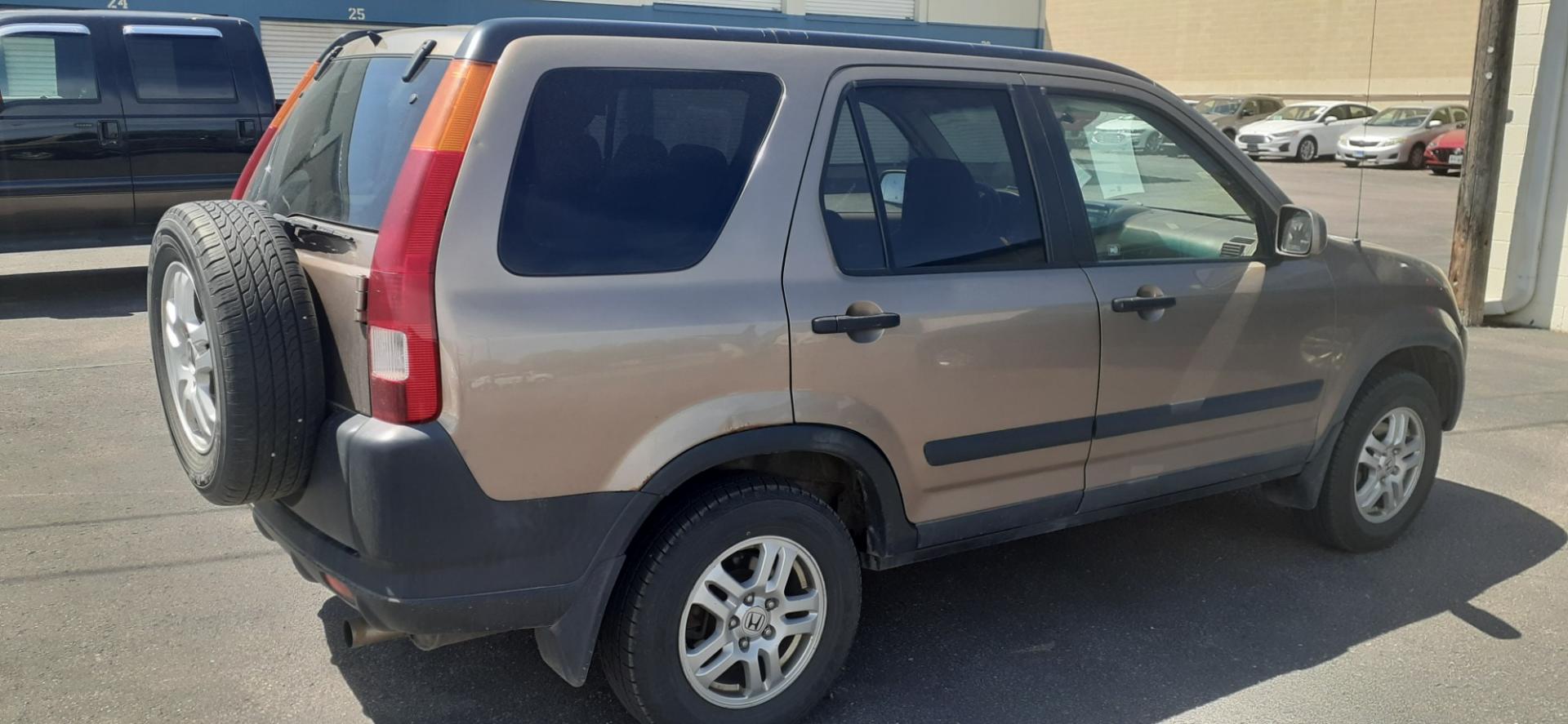 2004 Honda CR-V (JHLRD78854C) with an 2.4L L4 DOHC 16V engine, 4-Speed Automatic Overdrive transmission, located at 2015 Cambell Street, Rapid City, SD, 57701, (605) 342-8326, 44.066433, -103.191772 - CARFAX AVAILABLE - Photo#3